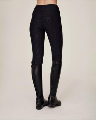 Back view of the black equestrian breeches showcasing the signature full seat silicone skull grip.