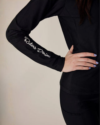 Close-up of the sleeve featuring the crisp white "Riders Denim" logo on the high-quality black performance fabric.