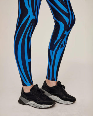 Close-up of the elastic ankle cuffs on the blue zebra riding tights, designed for a seamless fit under boots.