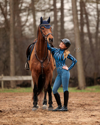 Influencer Rosita wearing a blue zebra riding top paired with Riders Denim original jeans breeches.